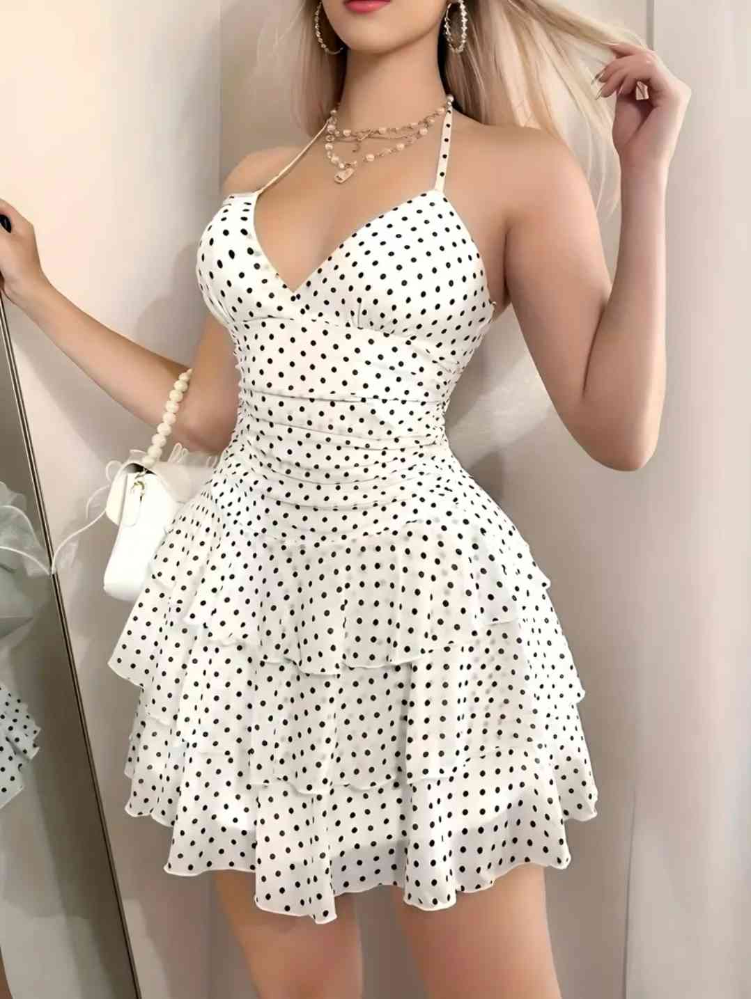 Y2K-inspired white hakter neck dress with black polka dots and floral accents